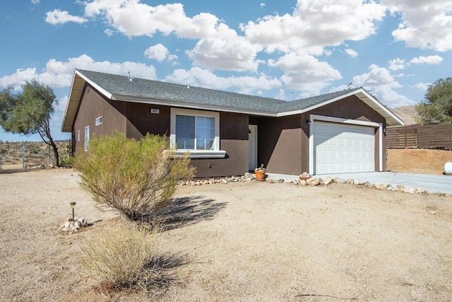 ranch-style home featuring a garage