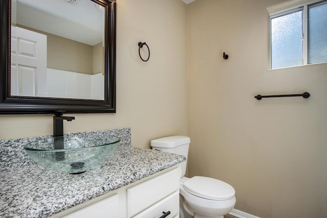 bathroom with vanity and toilet