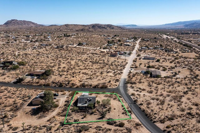 drone / aerial view featuring a mountain view