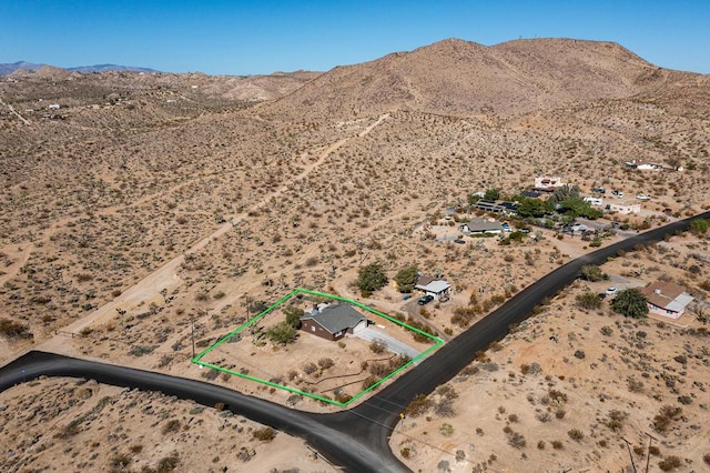 drone / aerial view featuring a mountain view