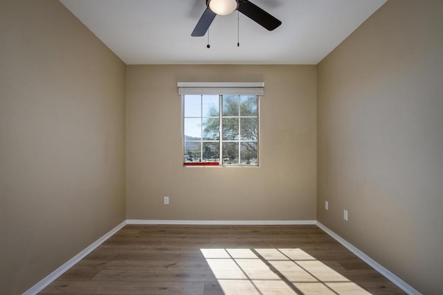 unfurnished room with ceiling fan and light hardwood / wood-style floors