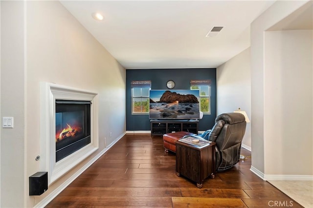 home theater room with dark wood-type flooring