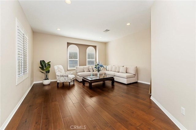 living room with dark hardwood / wood-style flooring