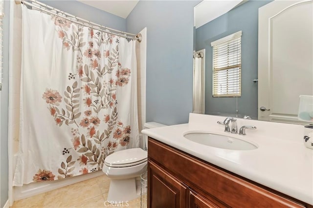 bathroom with vanity, tile patterned floors, and toilet