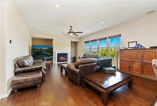 living room with dark hardwood / wood-style floors and ceiling fan