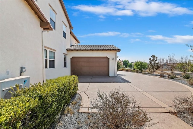 view of side of property featuring a garage