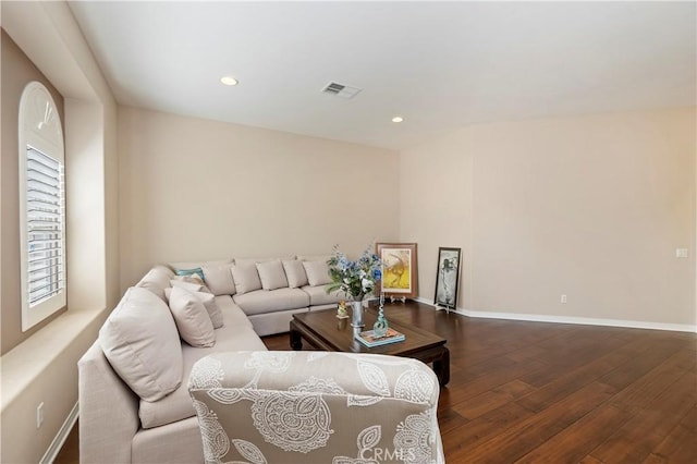 living room with dark hardwood / wood-style floors