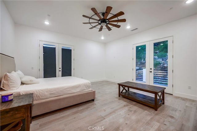 bedroom featuring french doors, ceiling fan, light wood-type flooring, and access to exterior