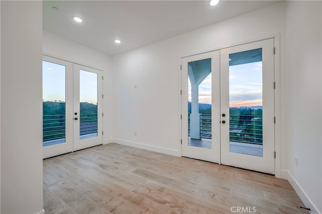 entryway with french doors and light wood-type flooring