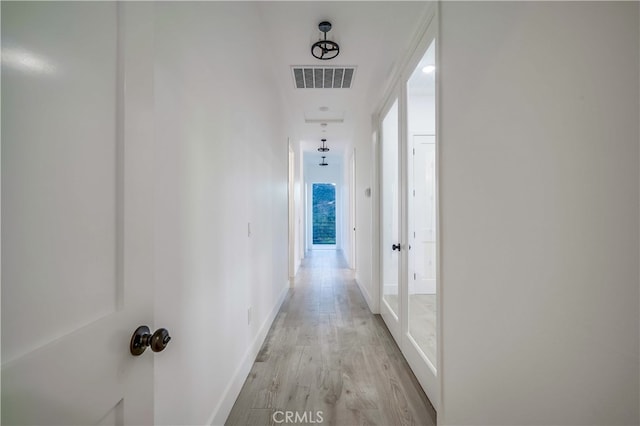 corridor featuring light wood-type flooring