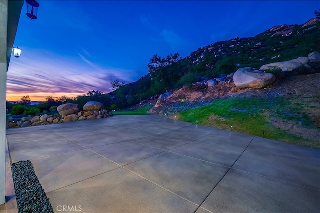 patio terrace at dusk with a mountain view