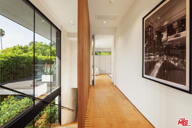 hall with light hardwood / wood-style floors