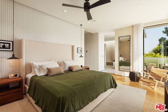 bedroom featuring ceiling fan and light wood-type flooring