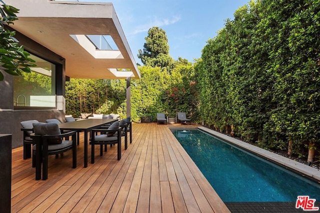 view of pool featuring a deck