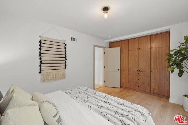 bedroom featuring light hardwood / wood-style flooring