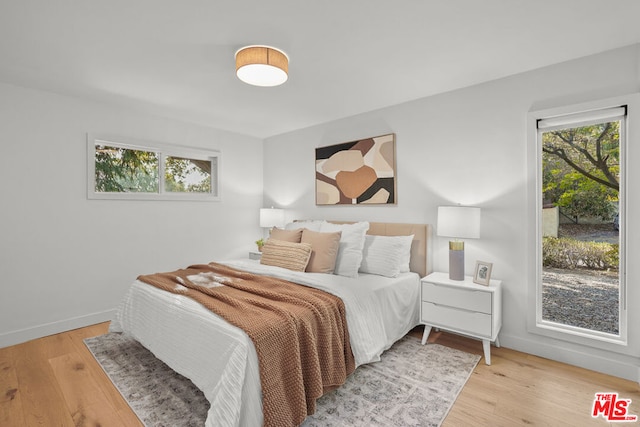 bedroom with light hardwood / wood-style flooring