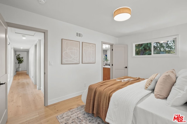 bedroom featuring light wood-type flooring