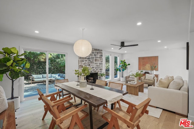 dining room with ceiling fan, plenty of natural light, and light wood-type flooring