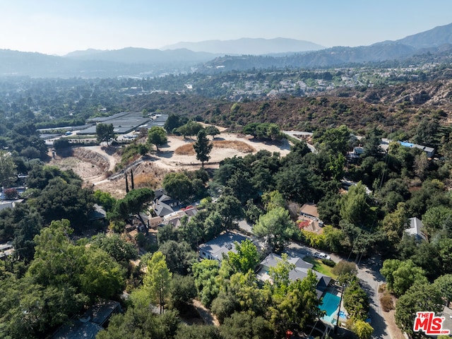 birds eye view of property featuring a mountain view