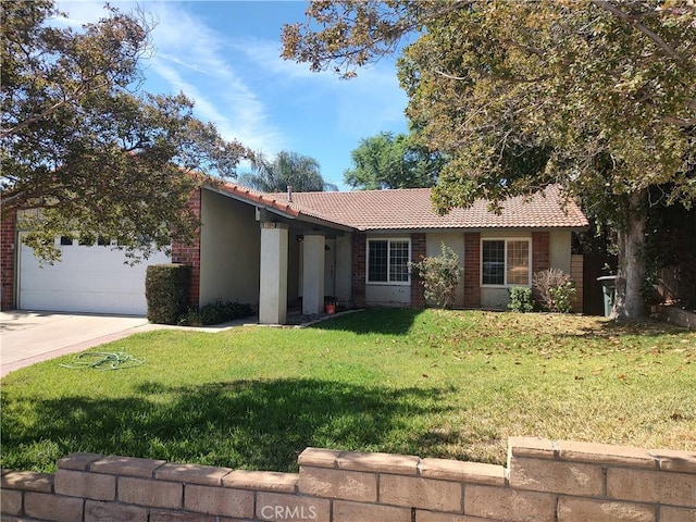 single story home featuring a garage and a front lawn