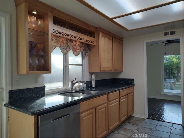 kitchen featuring ceiling fan, sink, dishwasher, light hardwood / wood-style flooring, and light brown cabinetry