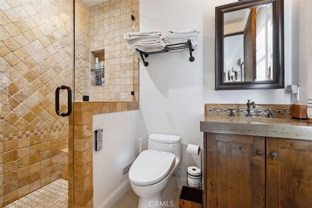 bathroom with vanity, toilet, and walk in shower