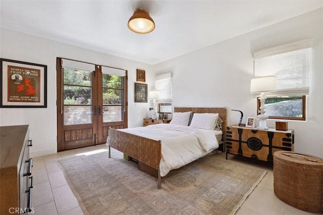 tiled bedroom featuring french doors