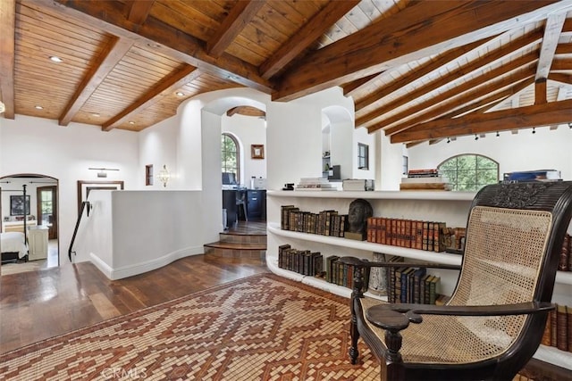 sitting room with wood ceiling, vaulted ceiling with beams, plenty of natural light, and wood-type flooring