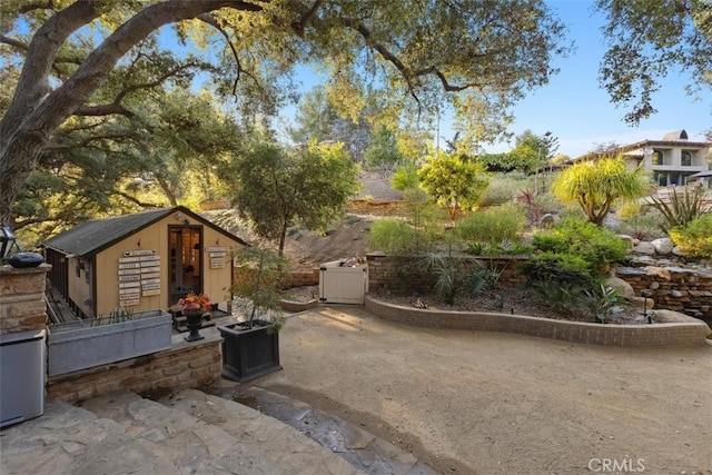 view of patio featuring a storage unit