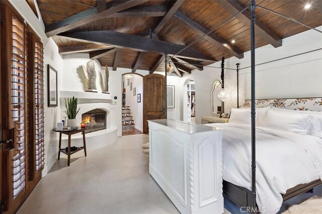 bedroom featuring vaulted ceiling with beams and wooden ceiling