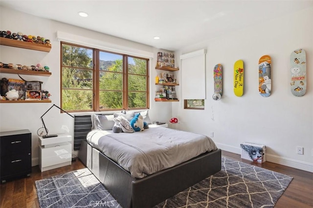 bedroom with dark wood-type flooring