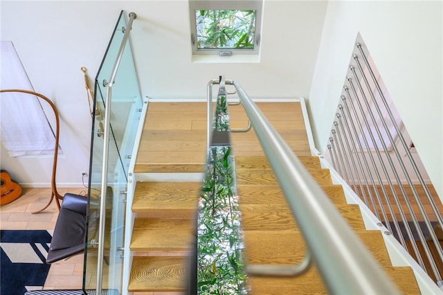 staircase featuring baseboards