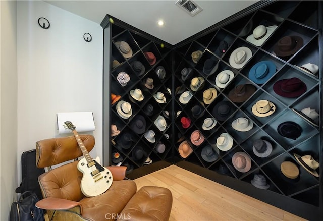 wine room featuring visible vents and wood finished floors