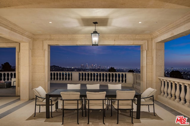 view of patio terrace at dusk