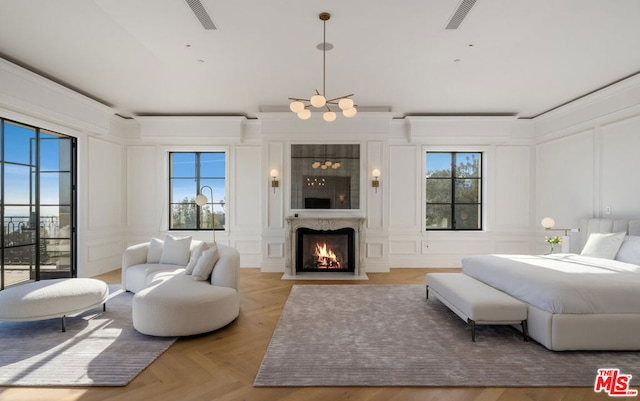 bedroom featuring light parquet floors and crown molding