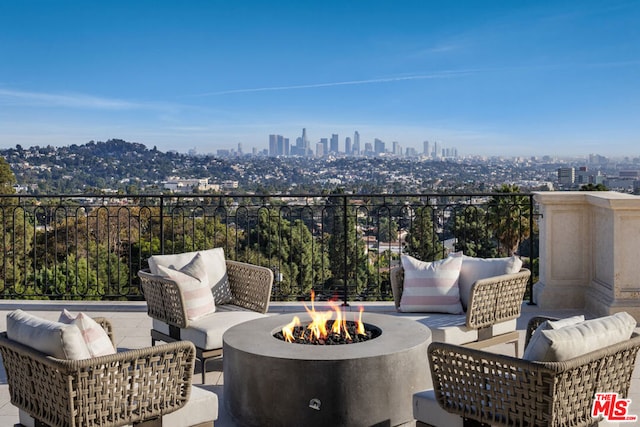 exterior space with a patio and an outdoor fire pit