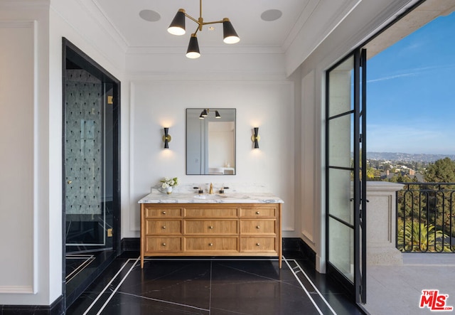 bathroom featuring ornamental molding and vanity