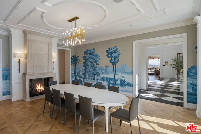 dining area featuring light parquet floors, a premium fireplace, a notable chandelier, and crown molding