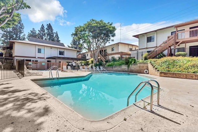 view of swimming pool featuring a patio area