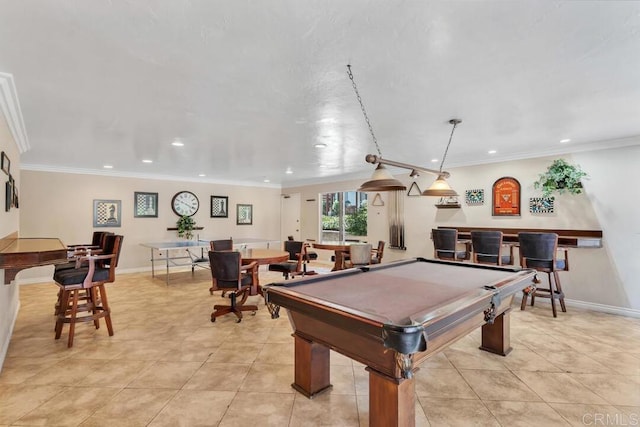 recreation room featuring crown molding, billiards, bar, and light tile patterned floors