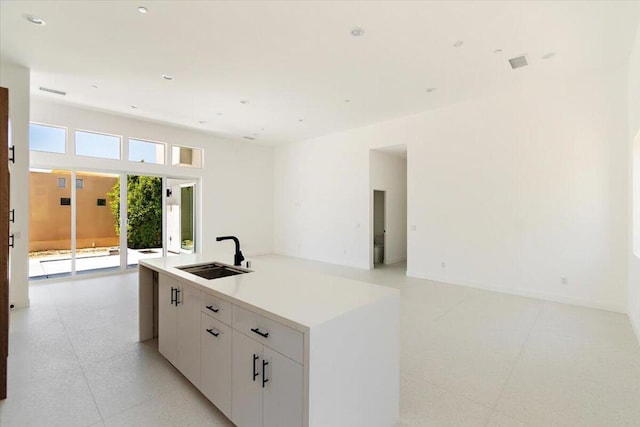 kitchen featuring sink and white cabinets