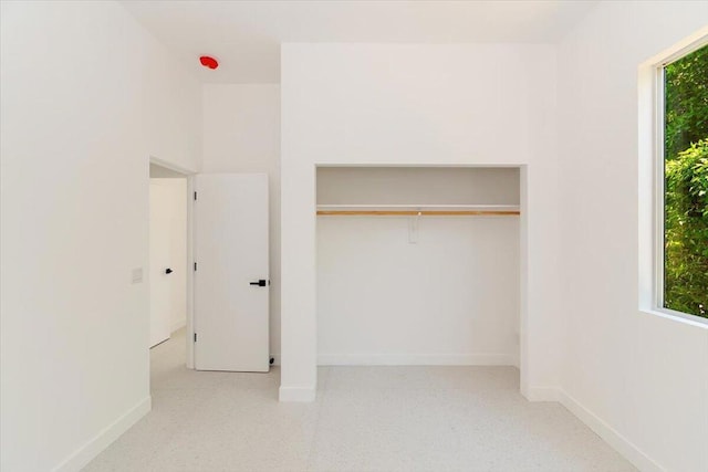 unfurnished bedroom with a closet