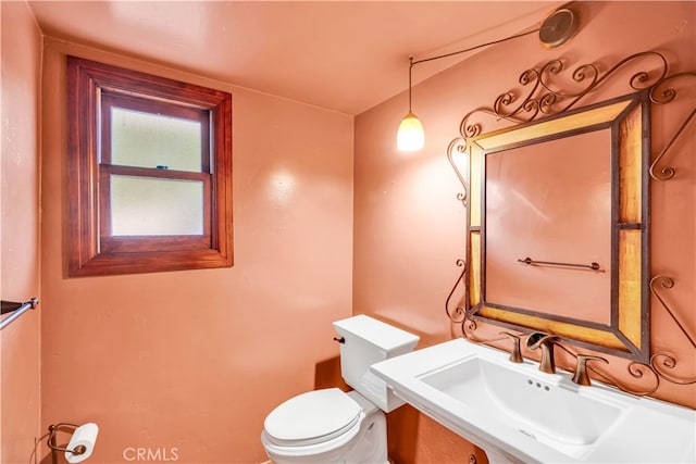 bathroom featuring toilet and sink