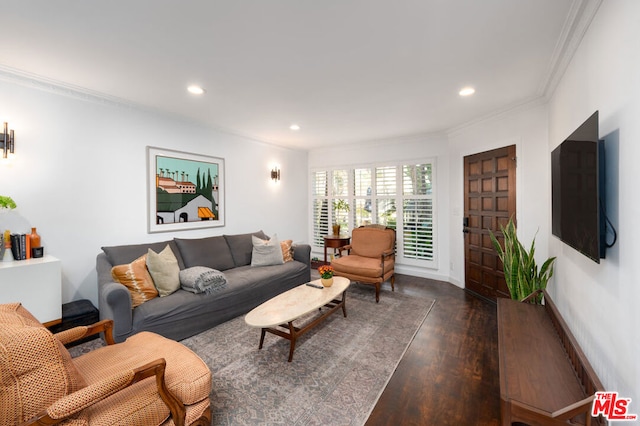 living room featuring dark hardwood / wood-style flooring and crown molding