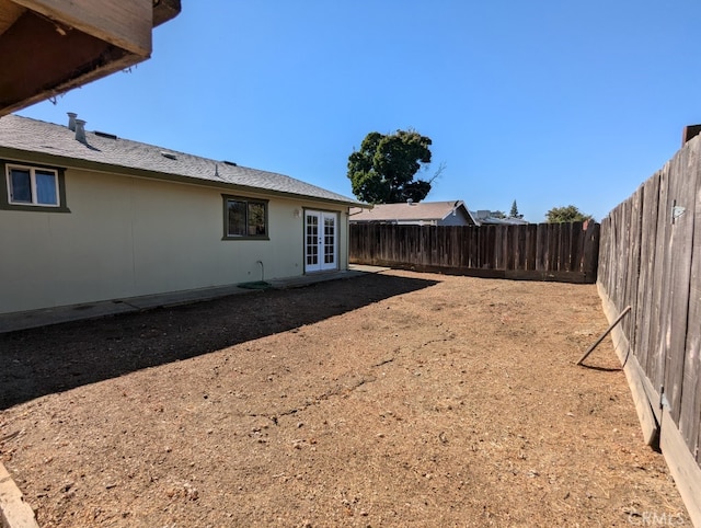 view of yard with french doors