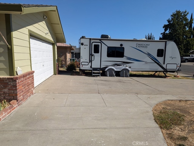 view of property exterior with a garage