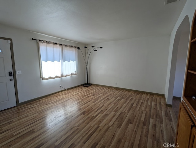 interior space with dark hardwood / wood-style floors