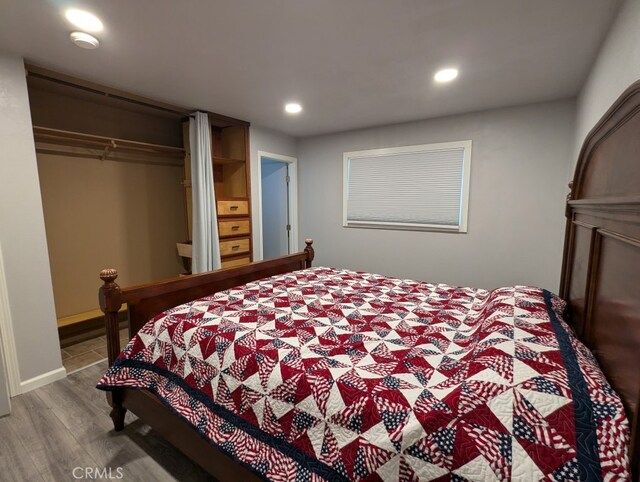 bedroom featuring a closet and hardwood / wood-style floors