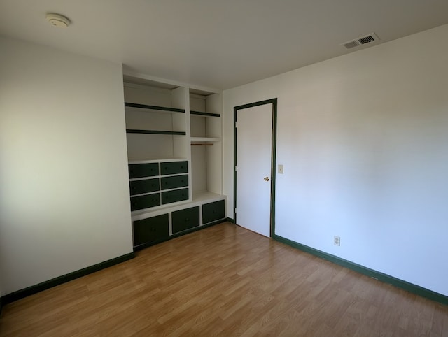 unfurnished bedroom featuring light wood-type flooring