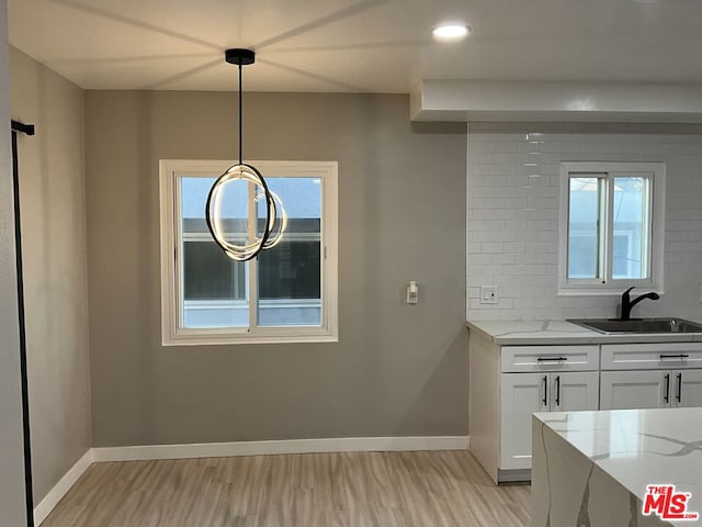 interior space featuring sink and light hardwood / wood-style floors